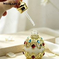 Flacon compte-gouttes en verre vintage orné de bijoux, flacon d'huile de parfum avec strass rouges et bleus et couvercle en boule de cristal
