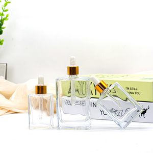 Tại Chỗ Phẳng Vuông Hình Chữ Nhật Sang Trọng <span class=keywords><strong>15Ml</strong></span> <span class=keywords><strong>30Ml</strong></span> 50Ml 100Ml Chai Thủy Tinh Nhỏ Giọt Với Cổ Áo Vàng Cho Huyết Thanh Tinh Dầu - Product Image 5