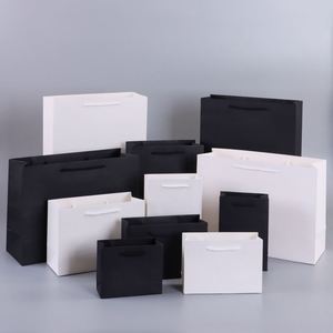 Sacs en papier de luxe blancs personnalisés avec logo imprimé pour boutiques de détail et cadeaux, avec poignée en ruban - Product Image 1