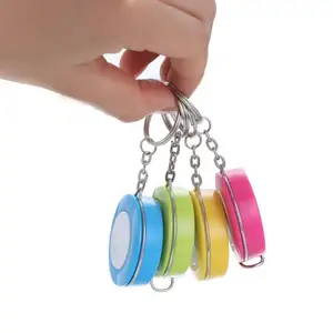 Băng biện pháp Mini Keychain Tự động thu nhỏ kẹo màu nhỏ Băng biện pháp mang theo công cụ phục hồi nhỏ Cai Trị mềm thước