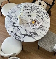 Table à manger en marbre de style crème moderne Plaque inférieure à support complet Conception ronde de haute qualité pour les petits ménages