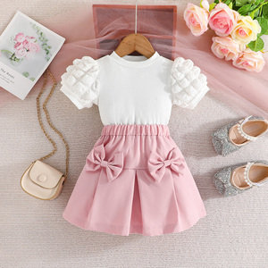 Ensemble Deux Pièces T-shirt à Manches Bulles et Jupe Courte à Nœud Couleur Unie pour Filles – Vente en Gros - Product Image 1