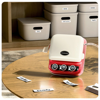 Machine à étiqueter Mini imprimante P15 Imprimante rouge avec bandes d'étiquettes du livre des réponses Fabricant d'autocollants thermiques pour la maison/le bureau/les loisirs