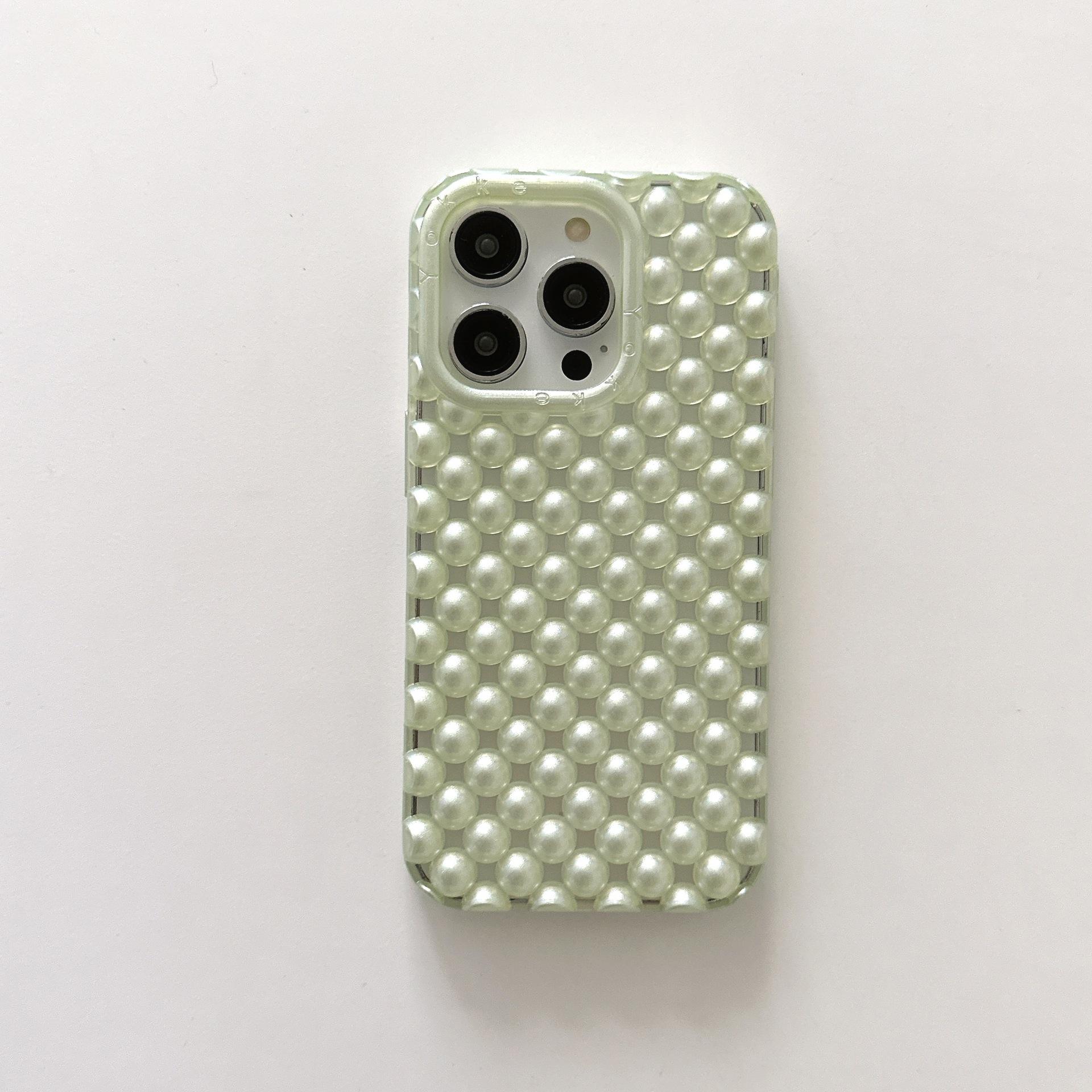 Perla hueca con verde translúcido.