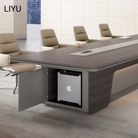 Table de conférence exécutive moderne avec armoire CPU dissimulée, base cannelée, éclairage LED intégré, extensible pour 12 personnes, idéale pour salle de réunion d'hôtel