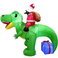 Père Noël gonflable lumineux sur un Tyrannosaurus Rex vert avec boîte cadeau pour la décoration de jardin, boutique, festival, exposition