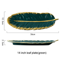 Assiette en porcelaine verte de style nordique de 14 pouces en forme de feuille de luxe avec bordure dorée Assiette en céramique écologique de style nordique Technique du gel