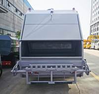 Camion de transport de déchets diesel ISUZU 4X2, capacité 7CBM/6m³, transmission manuelle, compacteur, moteur et boîte de vitesses intégrés