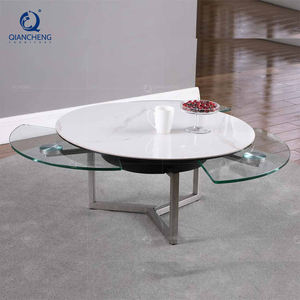 Vente en gros de Foshan <span class=keywords><strong>Table</strong></span> <span class=keywords><strong>basse</strong></span> pivotante en acier inoxydable de style moderne avec plaque de roche en <span class=keywords><strong>céramique</strong></span> mobile <span class=keywords><strong>Table</strong></span> centrale rotative en verre - Product Image 1