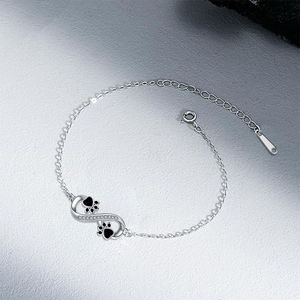 เครื่องประดับสัตว์เลี้ยงน่ารักคุณภาพสูงสไตล์ใหม่ปี 2025 ประดับด้วยประกายระยิบระยับ สร้อยข้อมือสแตนเลสรูปอุ้งเท้าอินฟินิตี้ - Product Image 2