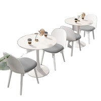 Ensemble de salle à manger de luxe moderne avec table ronde en marbre et chaises rembourrées pour petite cuisine et villa