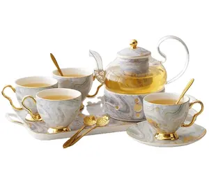 Factory price light luxury bone china tea sets and glass kettle with gift box and free spoon for hotel and home usage