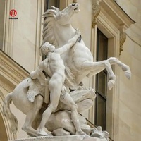 Sculpture grandeur nature en marbre blanc homme et cheval de Marly