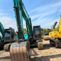 Excavatrice hydraulique sur chenilles d'occasion de 20 tonnes, de fabrication japonaise, Kobelco SK200D, pour démolition et travaux de renforcement.