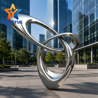Sculpture en ruban infini en acier inoxydable 304, poli miroir, sans soudure, boucle abstraite, personnalisable pour hôtels, jardins aquatiques et places publiques