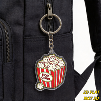 Porte-clés en acrylique en forme de seau de pop-corn, charmant, rayé rouge et blanc, avec des grains souriants, accessoire amusant pour soirée cinéma