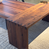 Table basse multifonctionnelle NORYA en bois massif avec plateau épais et patins de protection pour salon, mobilier en noyer
