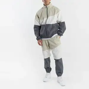 OEM biểu tượng tùy chỉnh bán buôn màu khối đồng bằng thường Áo gió trống Tracksuit Zip Up hoodie Set cho nam giới