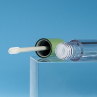 Récipient à rouge à lèvres en plastique transparent de luxe OEM Tube de balle de brillant à lèvres vide avec logo personnalisé avec sérigraphie Étiquetage cosmétique