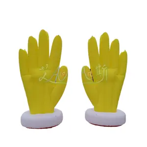 Ein Paar riesige gelbe aufblasbare Hand mit Boden luftgeblasenes Palmmodell für Outdoor-Dekorationen oder Veranstaltungen inklusive Luftgebläse