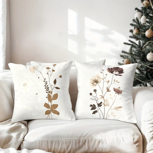 Elegantes cojines decorativos botánicos que adornan un sofá acogedor con calcetines navideños festivos y astas de reno en el fondo. - Product Image 3