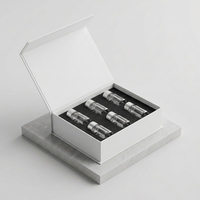 Boîte magnétique personnalisée pour l'emballage de flacons de parfum, boîte en papier de style livre à rabat de luxe avec logo UV spot