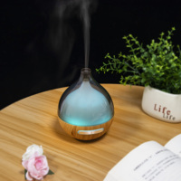 Diffuseur d'arômes ultrasonique transparent avec réservoir d'eau, humidificateur à brume froide et lumière LED à changement de couleur pour chambre à coucher et usage domestique