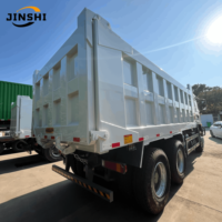 Популярный подержанный самосвал HOWO TX 6x4 Euro2, объем 12 м³, двигатель MAN, левый руль, дизельный