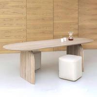 Table à manger sculpturale moderne avec base incurvée, silhouette ovale organique, idéale pour des réunions élégantes et spacieuses en salle à manger