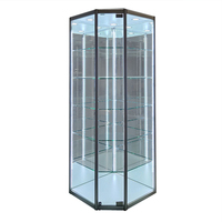 Vitrine d'angle pentagonale en verre avec cadre en métal noir pour l'exposition de volants, avec porte à ouverture unique verrouillable
