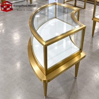 Vitrine de présentation de bijoux sur mesure en acier inoxydable doré avec verre trempé et éclairage LED pour la vente au détail