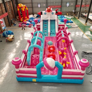 Parc de jeux gonflables géant sur le thème rose, château gonflable commercial avec toboggan et parcours d'obstacles pour fêtes et locations de parcs - Product Image 1