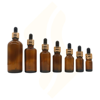 Vente Flacons compte-gouttes ronds en verre ambré avec couvercle en or pour huile capillaire cosmétique Huile essentielle 5ml 10ml 15ml 20ml 30ml 50ml 100ml
