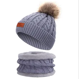 Wholesale Trendy 2Pcs Custom Children's Winter Warm Knitted Cap Faux Fur Pom Pom Hats Toddler Beanie Scarf Set