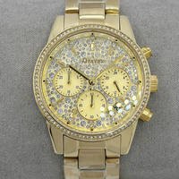 Montre chronographe de luxe pour femmes MKOriginals en acier inoxydable doré, avec lunette pavée de cristaux, aiguilles, étanche, fermoir pliant