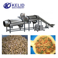 Machine de traitement d'aliments pour chiens Extrudeuse à double vis en acier inoxydable contrôlée par PLC pour ligne de production d'aliments secs pour animaux de compagnie