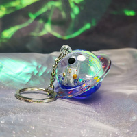 Cadeaux originaux Mini porte-clés astronaute 3D Porte-clés vaisseau spatial liquide Porte-clés mystérieux Espace Aqua Huile