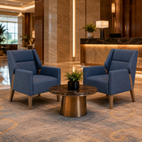 Fauteuil rembourré bleu pour l'hôtellerie, idéal pour les chambres d'hôtel, les suites, les halls d'accueil et les achats en gros