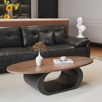 Table basse en bois massif de noyer avec un design minimaliste moderne, forme ovale, pour le salon