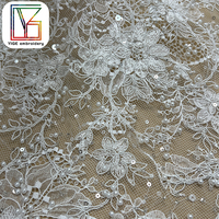 Tissu de dentelle de tulle perlé de luxe brodé à la main avec des perles et des sequins pour robe de soirée