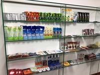 Machine d'emballage rotative pour sachets préformés de lessive liquide et de détergent, machine de remplissage de sachets à bec verseur