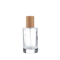 Flacon de parfum cylindrique en verre haut de gamme en stock, base épaisse, capacité 100 ml, bouchon à visser manuel, tête de pompe pulvérisatrice, Chine