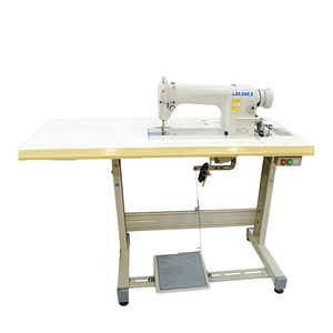 Machine à coudre industrielle automatique à lit plat DDL-8700 d'occasion avec moteur à économie d'énergie - Product Image 1