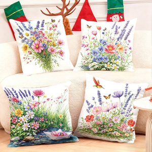 Almohadas florales que decoran un sofá acogedor con medias navideñas y astas de ciervo en el fondo - Product Image 1