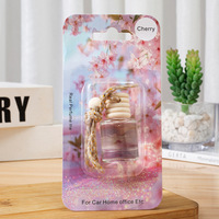 Diffuseur de parfum cylindrique en verre pour voiture, emballage sous blister à cinq lignes, pendentif de voiture, ornement suspendu pour véhicule, huile essentielle