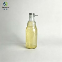 Bouteille en verre décorative transparente gaufrée vide de 330 ml, idéale pour l'embouteillage commercial et la présentation de marques en format cadeau
