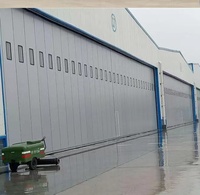 Panneau sandwich en acier automatique industriel de grande envergure Porte pliante horizontale à isolation thermique Porte de sécurité électrique