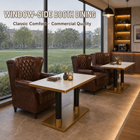 Fauteuil d'angle en cuir de luxe avec dossier capitonné pour salon, fauteuil club avec table en pierre pour café et bar d'hôtel