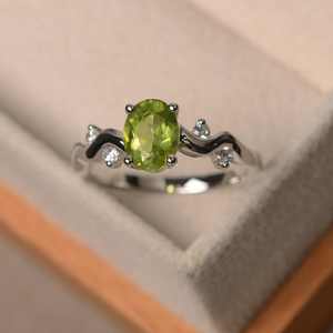 Elegant and Luxurious Natural <b>Peridot</b> Engagement <b>Ring</b> Fine Jewelry with an Oval Cut Green Gemstone - Product Image 4