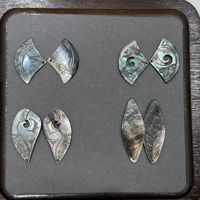 Fabricant d'accessoires de bijoux en coquillages naturels, coquillages nacrés noirs, motifs sculptés de manière complexe, boucles d'oreilles, pendentifs, artisanat DIY